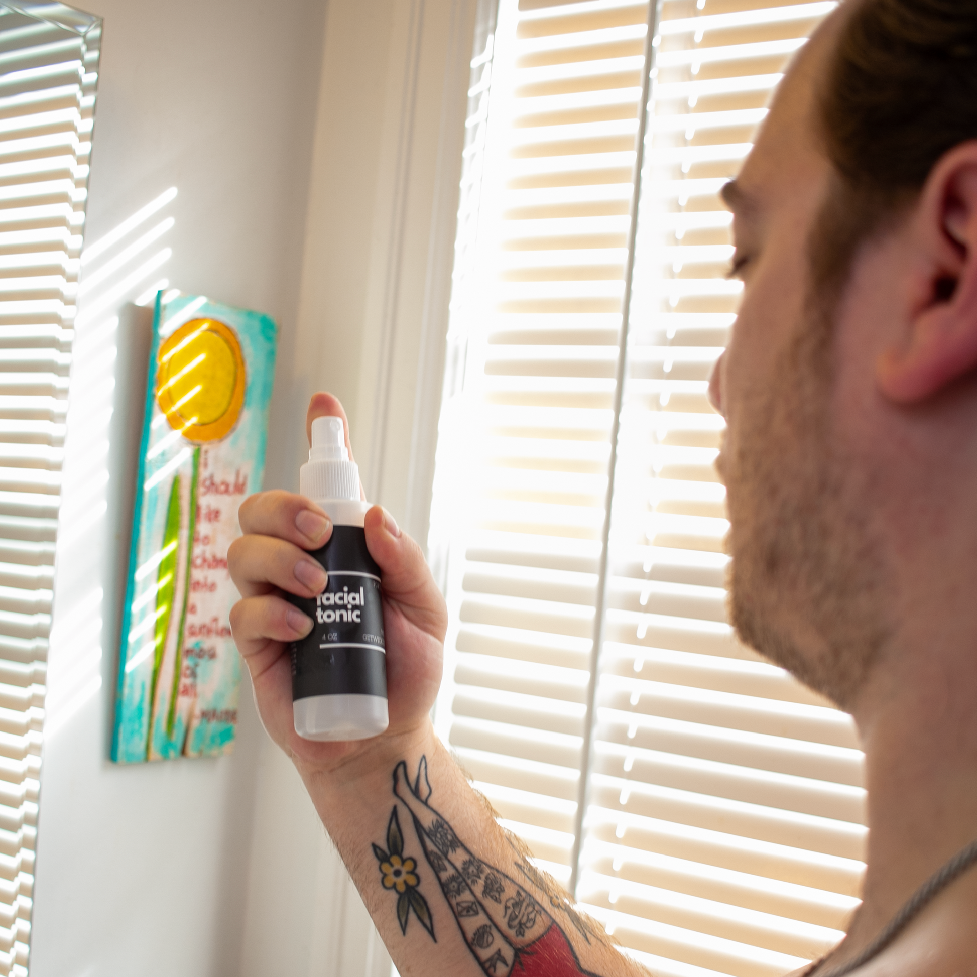 Close-up image of Wicked Fox's Facial Tonic, a skincare spray made in Portland. The bottle has a sleek design with the brand's distinctive fox logo. Ideal for gay queer men seeking to enhance their natural glow and rejuvenate their skin.