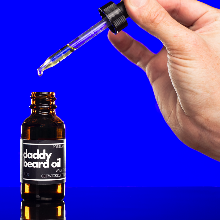 Wicked Fox's Daddy Beard Oil in a sleek bottle. Perfect for gay men seeking quality beard care online. Infused with a seductive leather scent, it's a favorite in the BDSM community. This beard oil not only reduces ingrown hairs but also imparts a sexy smell for irresistible facial hair.