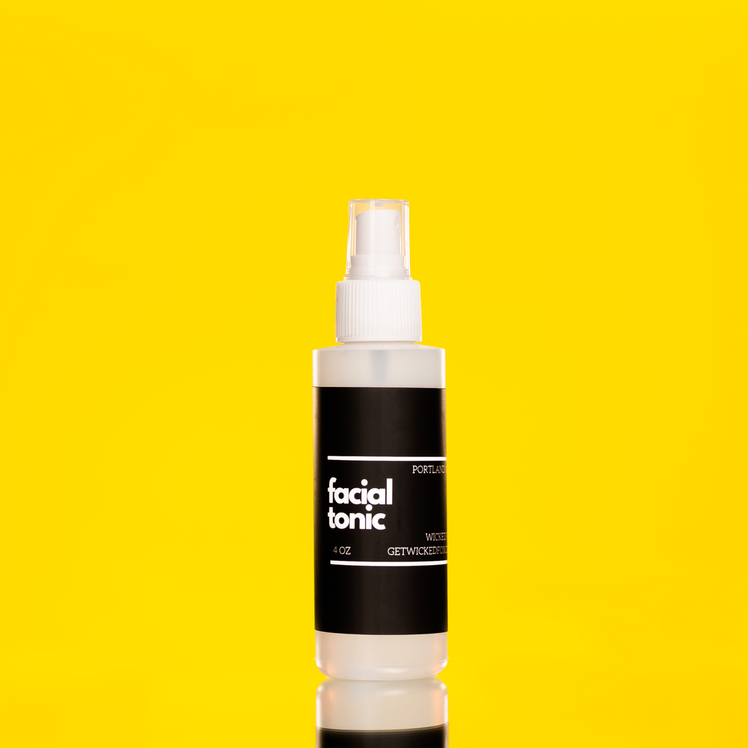 Close-up image of Wicked Fox's Facial Tonic, a skincare spray made in Portland. The bottle has a sleek design with the brand's distinctive fox logo. Ideal for gay queer men seeking to enhance their natural glow and rejuvenate their skin.