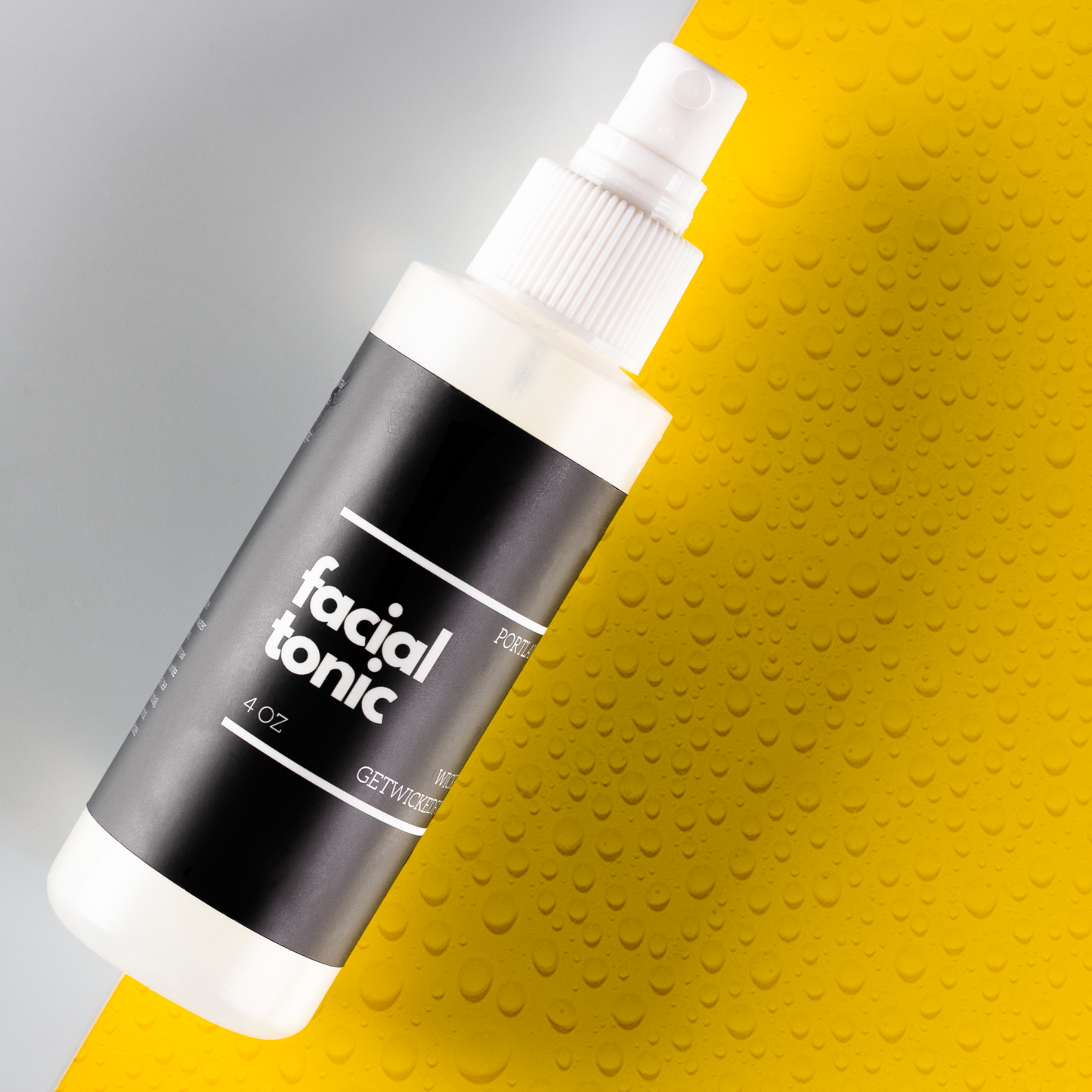 Close-up image of Wicked Fox's Facial Tonic, a skincare spray made in Portland. The bottle has a sleek design with the brand's distinctive fox logo. Ideal for gay queer men seeking to enhance their natural glow and rejuvenate their skin.