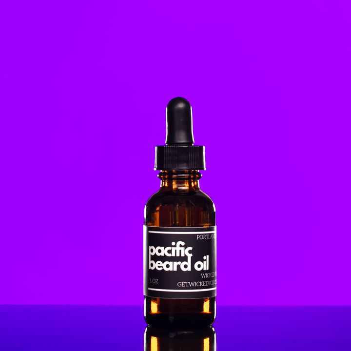 Bottle of Wicked Fox's Pacific Beard Oil, a premium beard care product specially designed for gay men. This sweet, masculine-scented oil not only softens facial hair but also prevents ingrown hairs, making you irresistibly kissable. Ideal for enhancing your online beard product search.