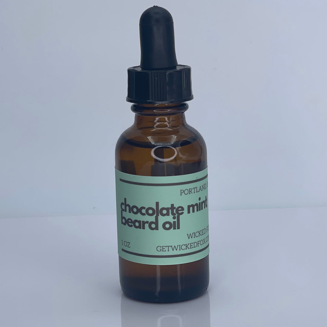 Indulge in the delightful scent of Wicked Fox Chocolate Mint Beard Oil. Perfect for gay men seeking high-quality beard products online. Elevate your grooming routine with our organic Jojoba Seed Oil and Argan Oil blend. Hydrate and strengthen your facial hair with this irresistible scent of chocolate mint.