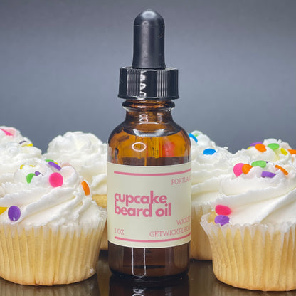 A bottle of Wicked Fox's Cupcake Beard Oil, enriched with natural ingredients, designed for the grooming needs of queer and trans men. Perfect for softening facial hair and reducing skin blemishes. Ideal beard care product for gay men shopping online.