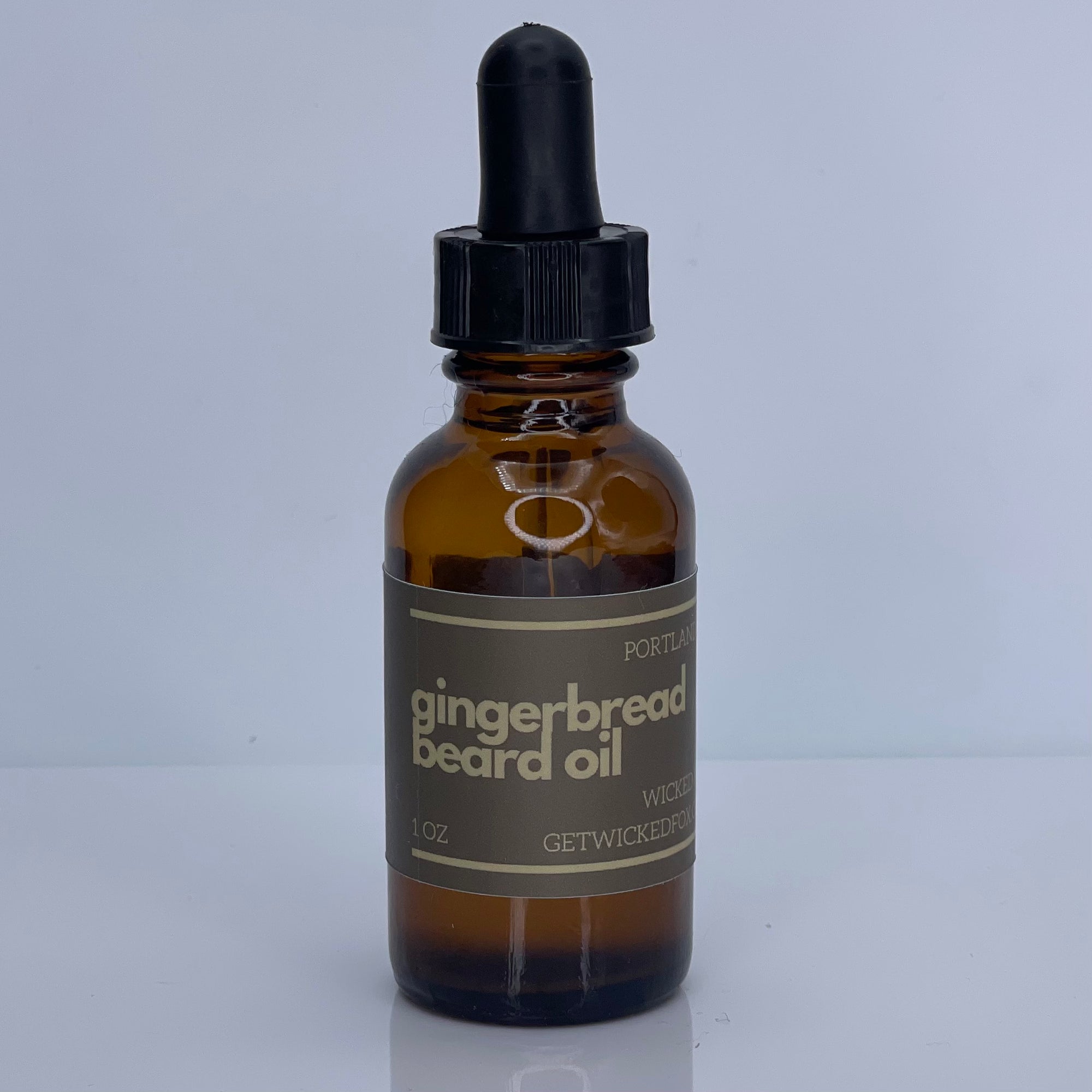 Wicked Fox's Gingerbread Beard Oil in a sleek bottle, ideal for gay men. This premium beard product reduces ingrown hairs, softens facial hair, and features an irresistible gingerbread scent, making you more kissable. Perfect choice for men looking to enhance their beard care routine with a sweet twist.