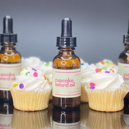 A bottle of Wicked Fox's Cupcake Beard Oil, enriched with natural ingredients, designed for the grooming needs of queer and trans men. Perfect for softening facial hair and reducing skin blemishes. Ideal beard care product for gay men shopping online.