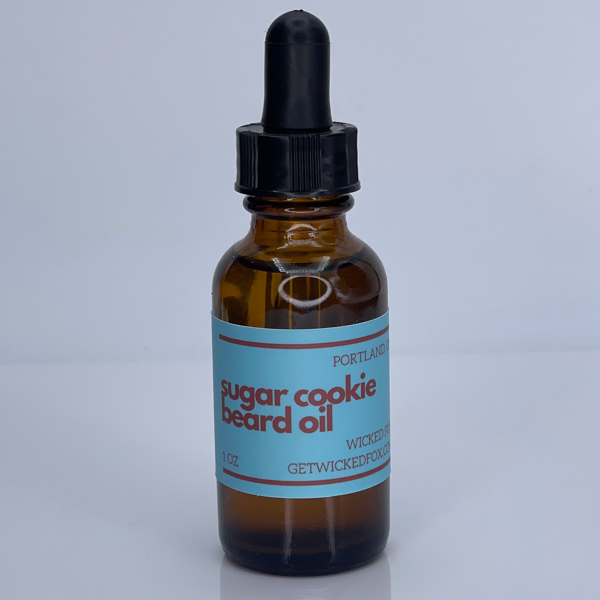 Wicked Fox's Sugar Cookie Beard Oil, a premium beard care product for gay men. This beard oil softens facial hair, reduces ingrown hairs, and leaves a sweet sugar cookie scent, making you irresistible and more kissable. Perfect for enhancing your online shopping experience for LGBTQ+ friendly beard products.