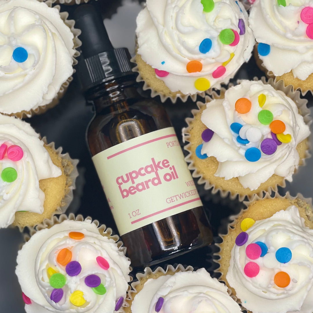 A bottle of Wicked Fox's Cupcake Beard Oil, enriched with natural ingredients, designed for the grooming needs of queer and trans men. Perfect for softening facial hair and reducing skin blemishes. Ideal beard care product for gay men shopping online.