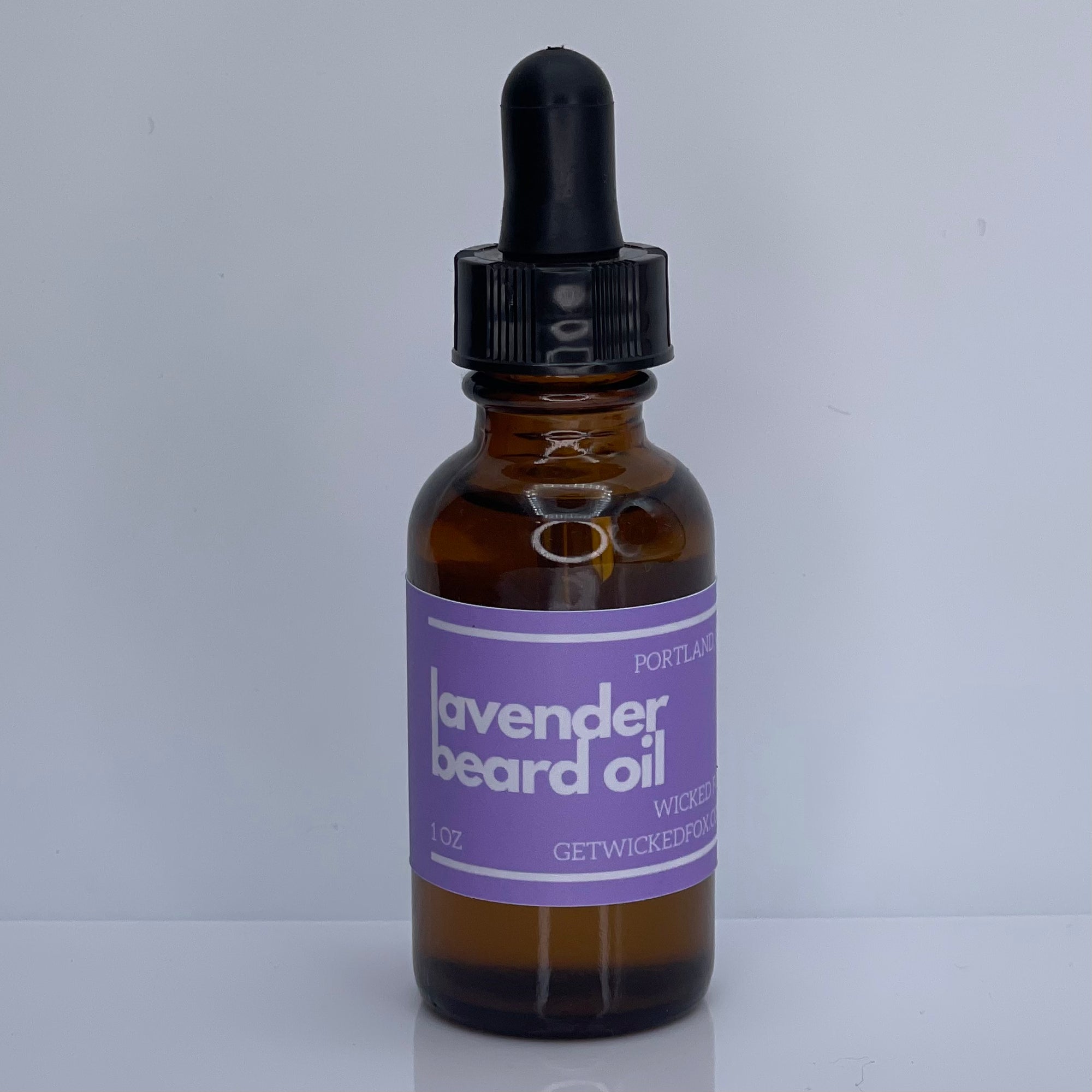 Wicked Fox's Lavender Beard Oil, a premium beard care product specifically designed for gay men. This oil reduces ingrown hairs, softens facial hair, and leaves a sweet lavender scent, making you irresistibly kissable. Ideal for online shoppers seeking high-quality, LGBTQ+ friendly beard products.